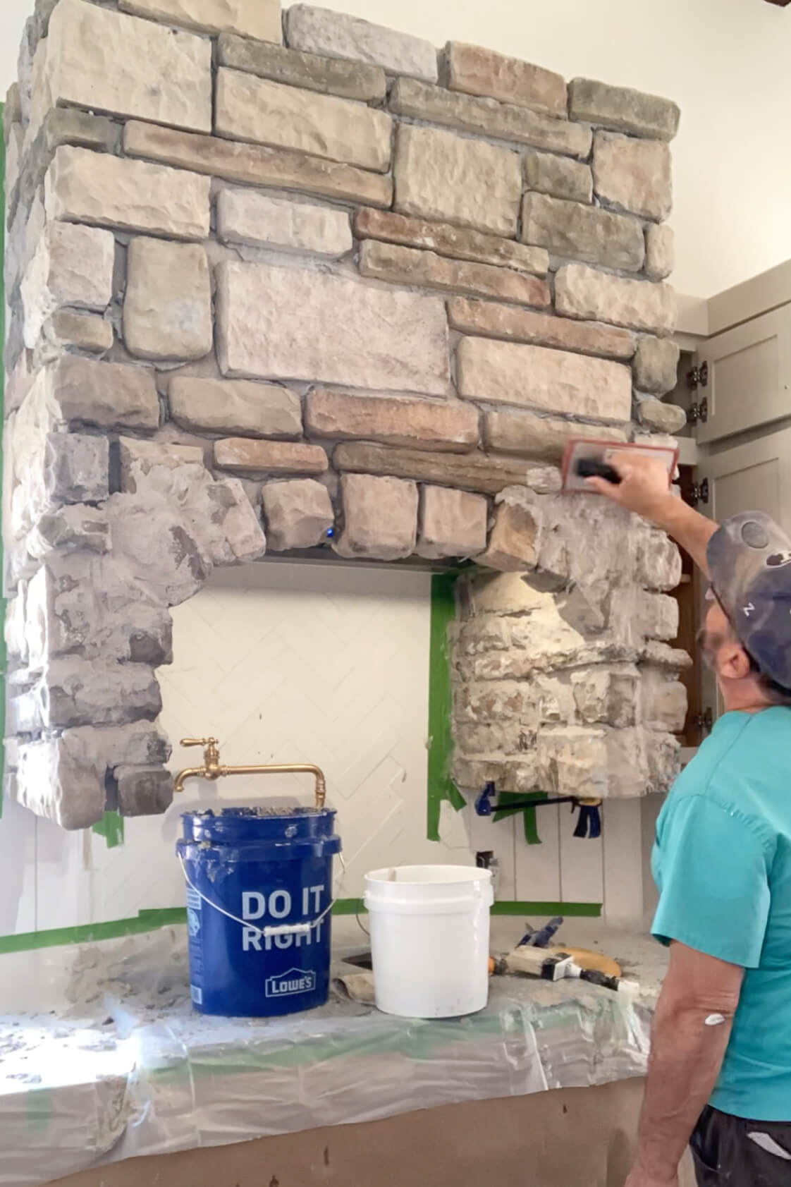 Smoothing out mortar with a grout float.
